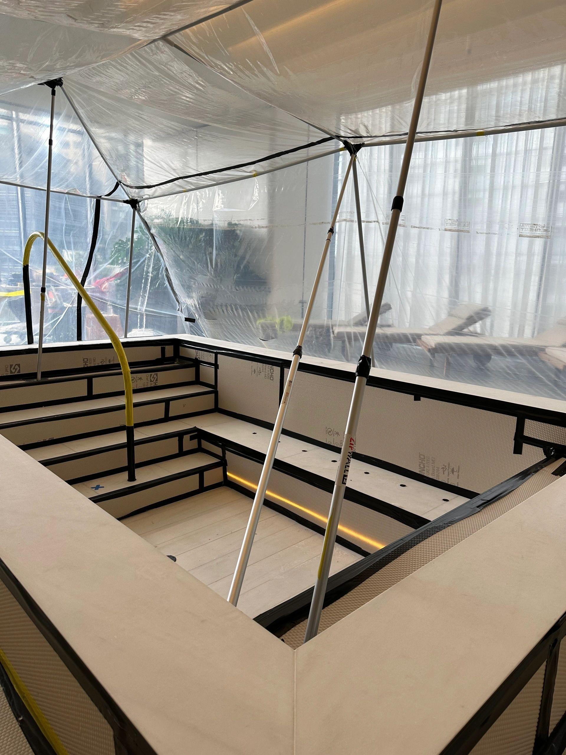 A spa surround sealed under M&M containment and protection